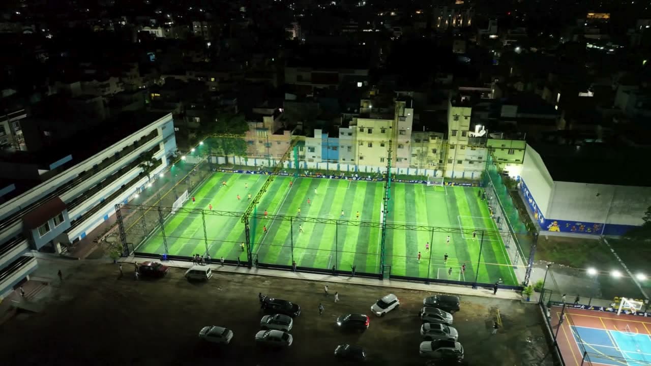 Floodlit box cricket turf at night